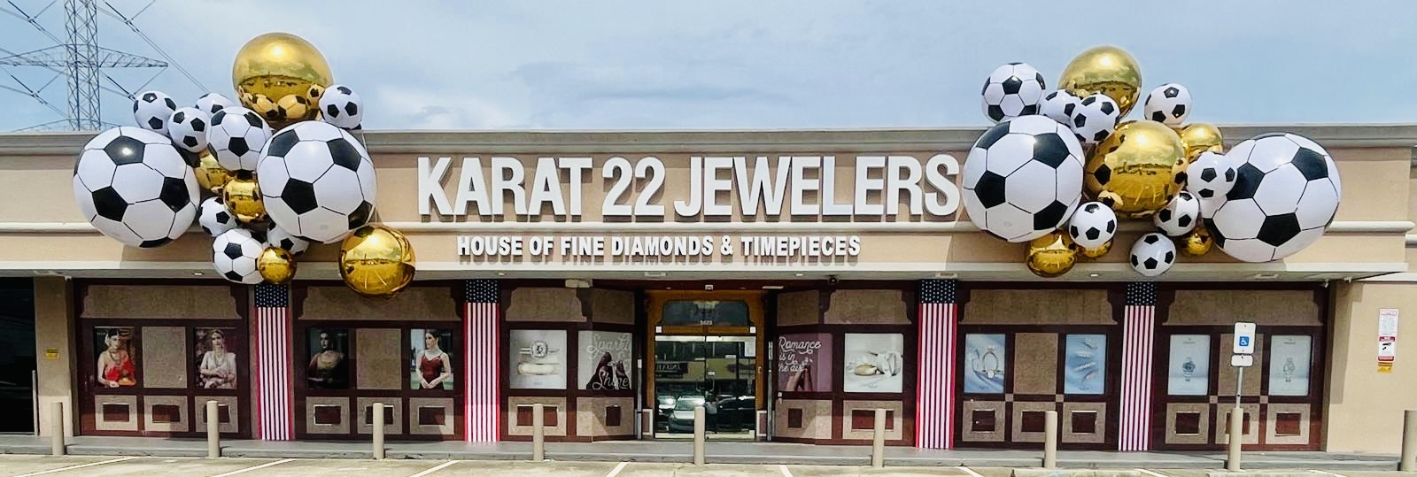 Karat 22 Jewelers storefront in Houston decorated for the World Cup and America's 250th anniversary