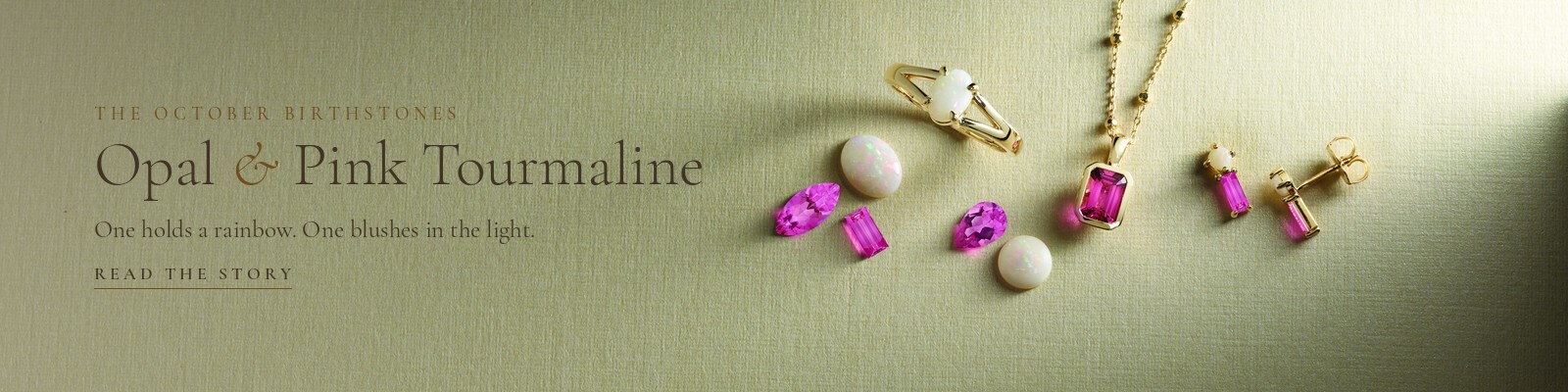 White opal and pink tourmaline gemstones with an opal ring, pink tourmaline pendant and drop earrings in yellow gold, the October birthstones, at Karat 22 Jewelers in Houston